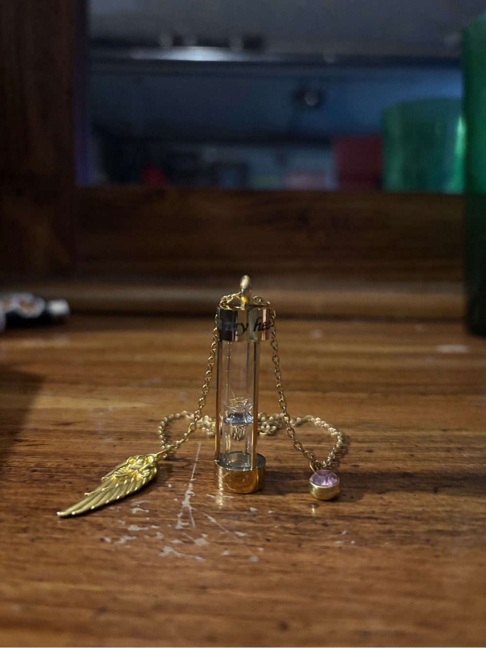 Gold Wing Charm Necklace with Pink Crystal and Glass Vial memorial Pendant.